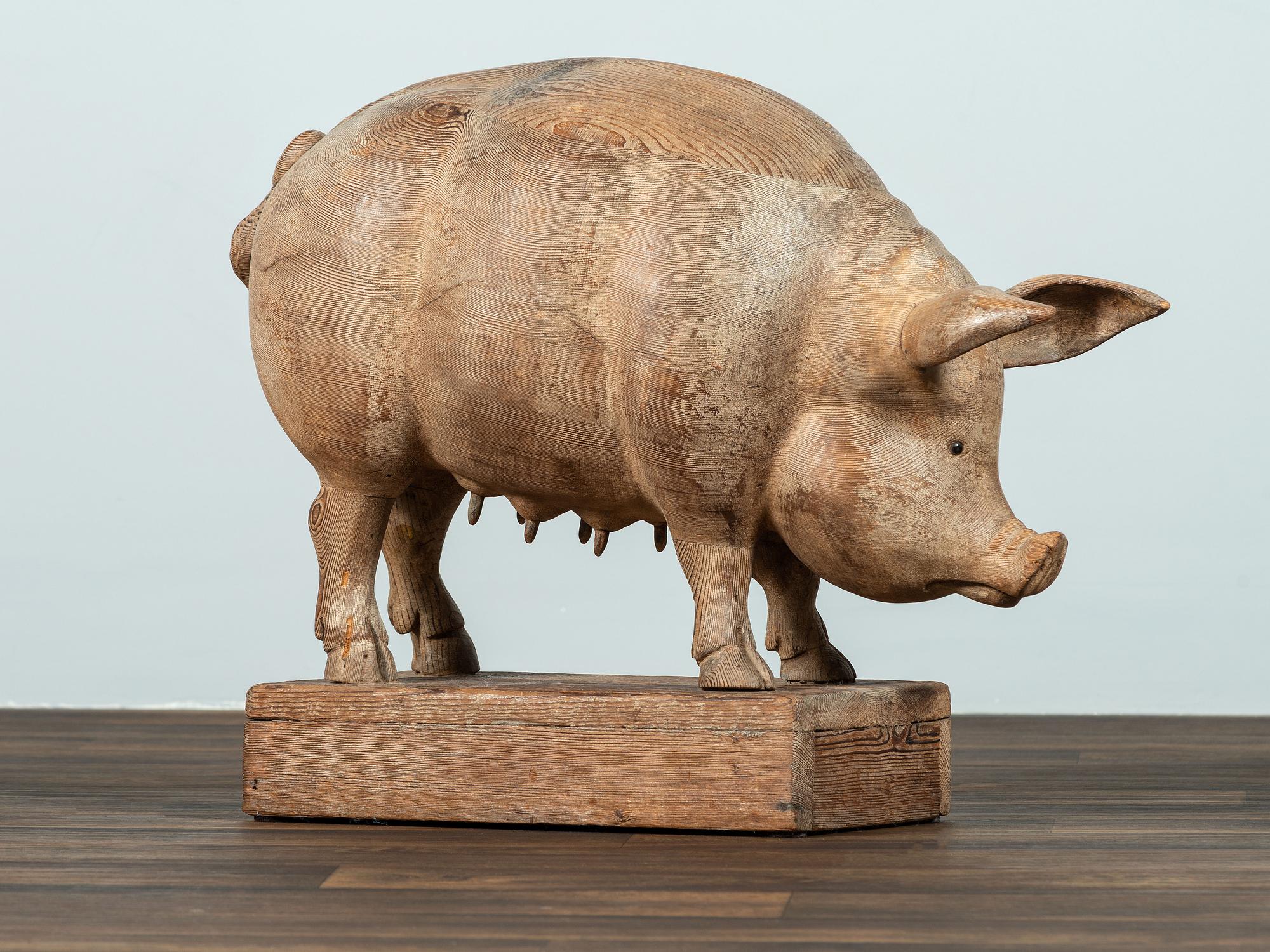 A Folk Art Carved Wood Figure of a Sow