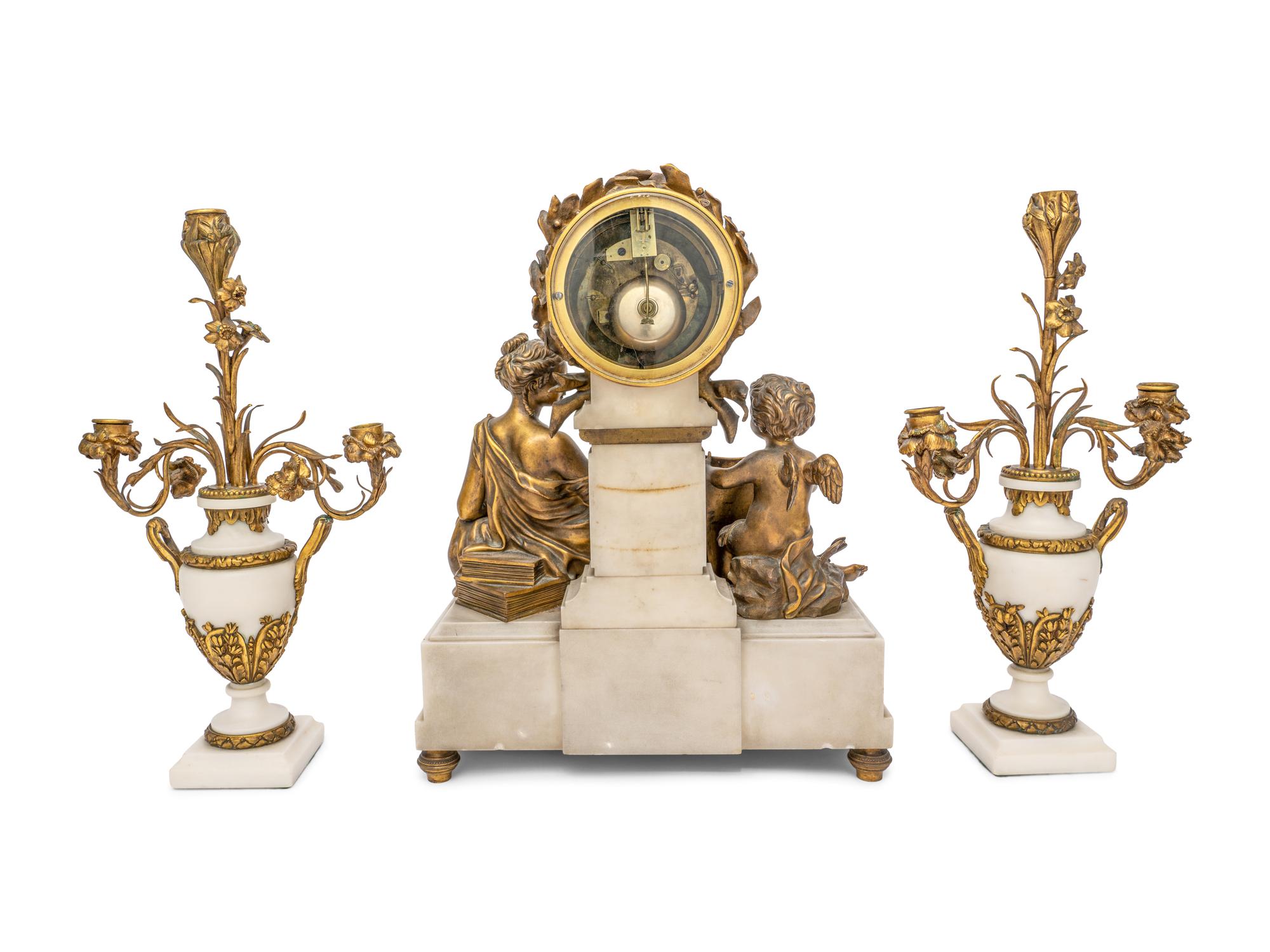 A French Gilt Bronze and Marble Clock Garniture