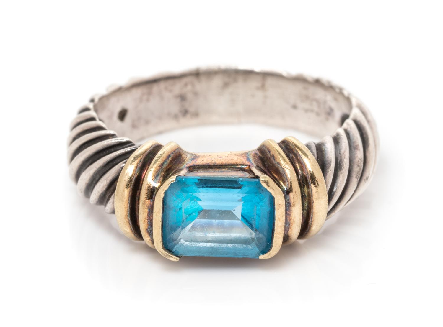 A Sterling Silver, 14 Karat Yellow Gold and Blue Topaz Ring, David Yurman, 4.10 dwts.