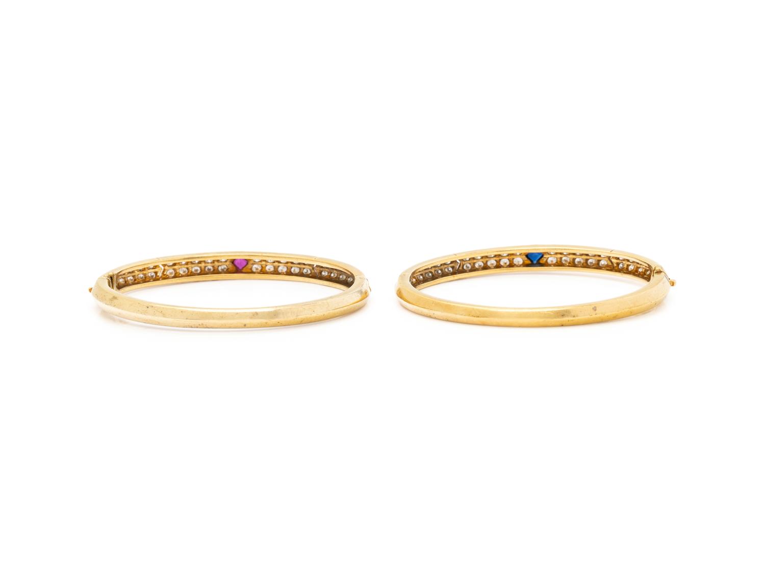 VAN CLEEF & ARPELS, PAIR OF YELLOW GOLD, DIAMOND, RUBY AND SAPPHIRE BANGLE BRACELETS
