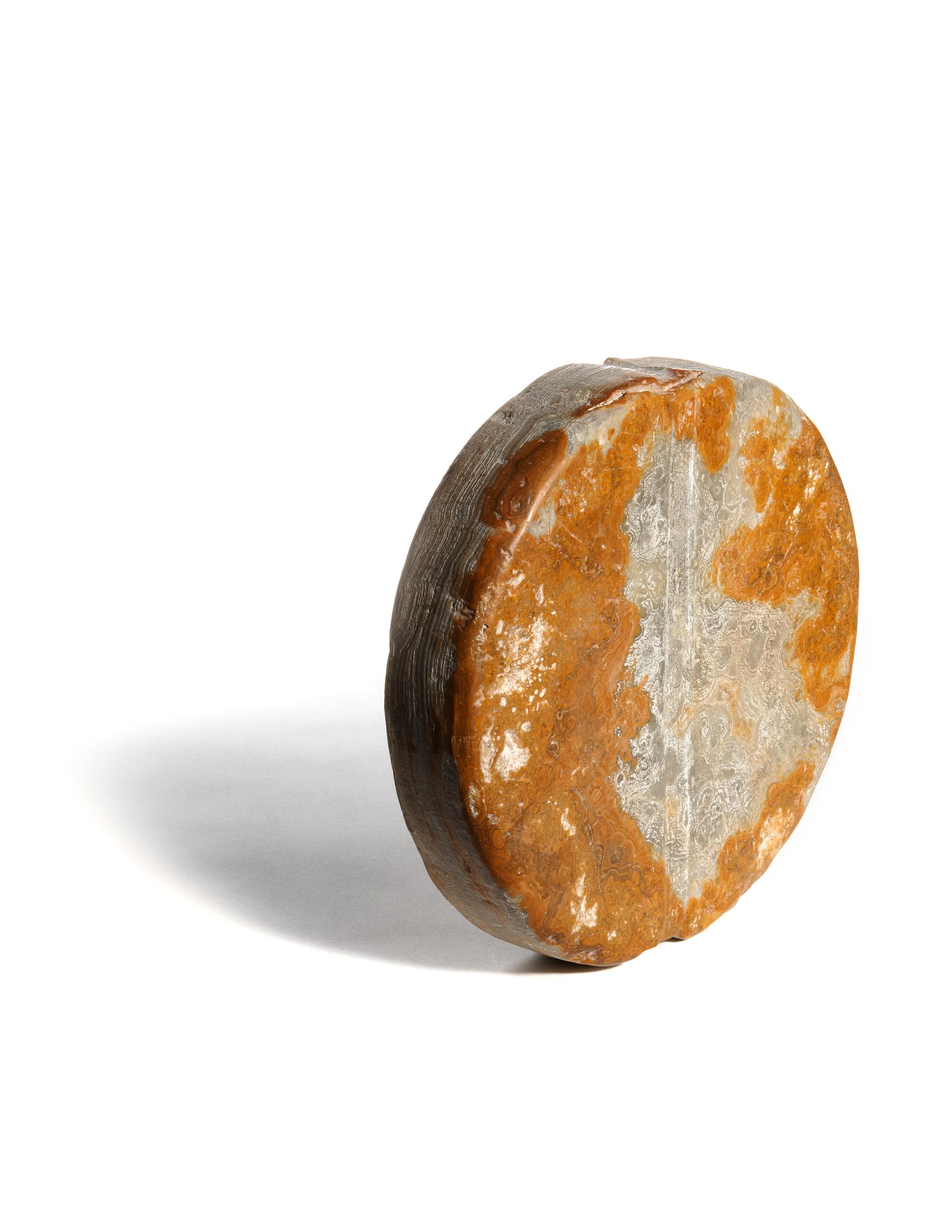 A Bactrian Mottled Green-Orange Stone Disk Ritual Object