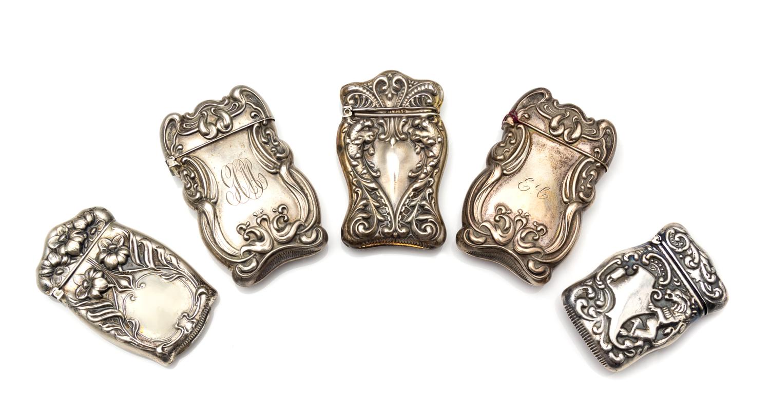 A Collection of Five American Silver Vesta Cases, Various Makers, comprising a pair with Art Nouveau style borders; an example having f