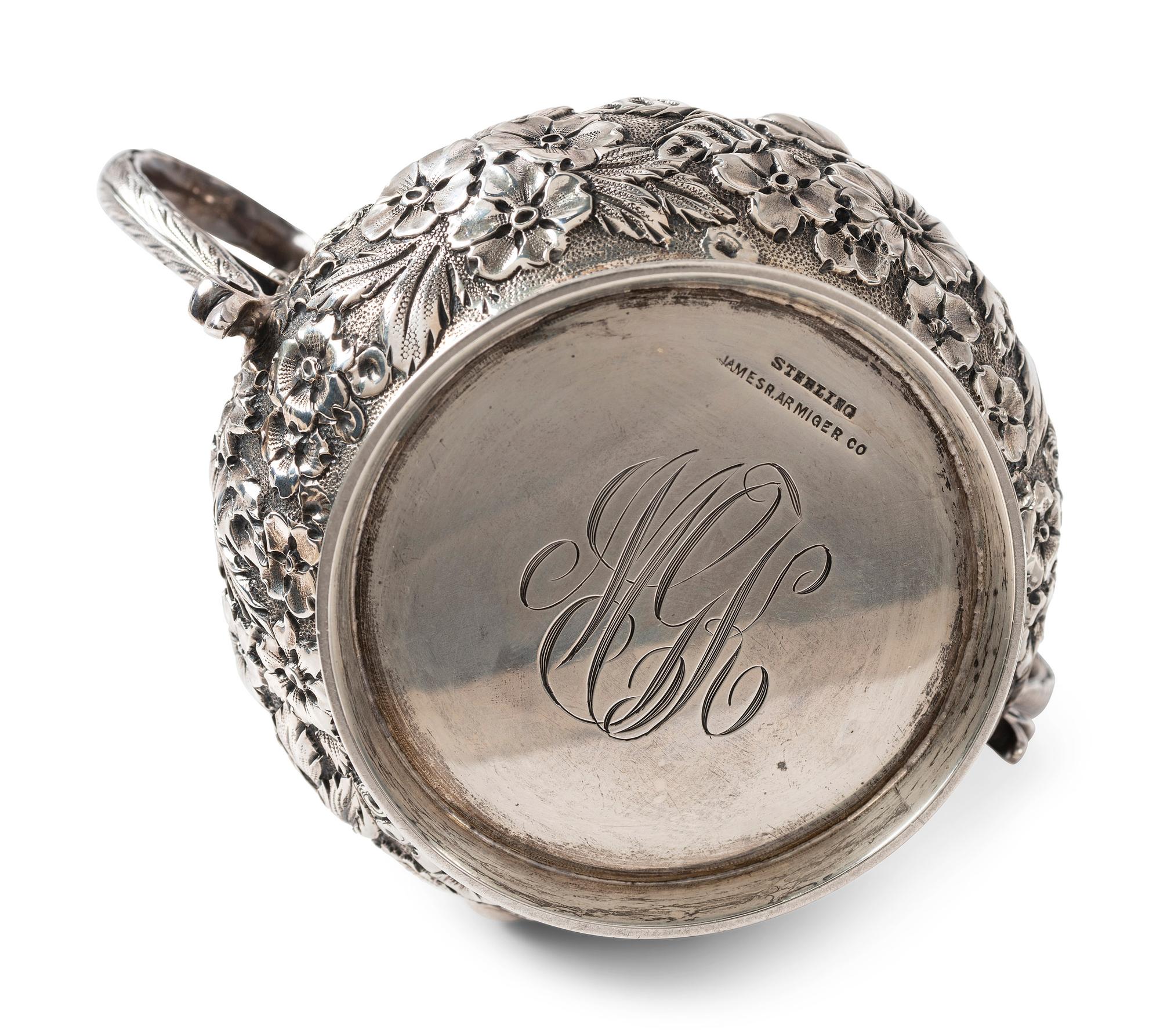A Repousse Silver Three-Piece Tea Service