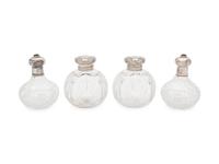Two Pairs of English Silver Mounted Cut Glass Bottles