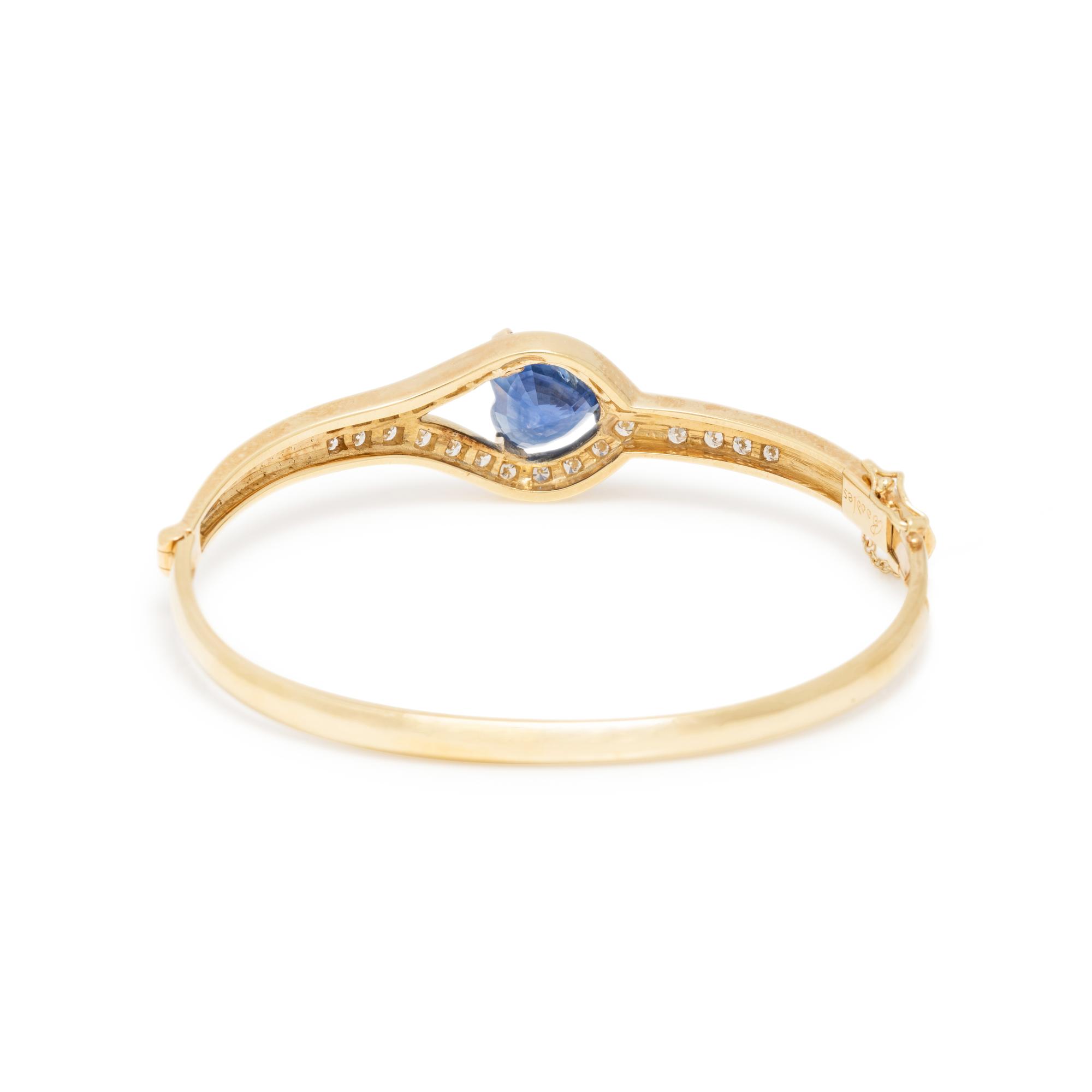 BOODLE & DUNTHORNE, YELLOW GOLD, SAPPHIRE, AND DIAMOND BANGLE BRACELET