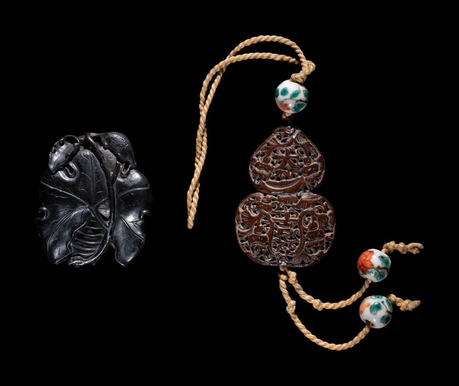Two Chinese Carved Wood Pendants