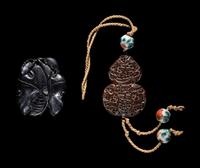 Two Chinese Carved Wood Pendants