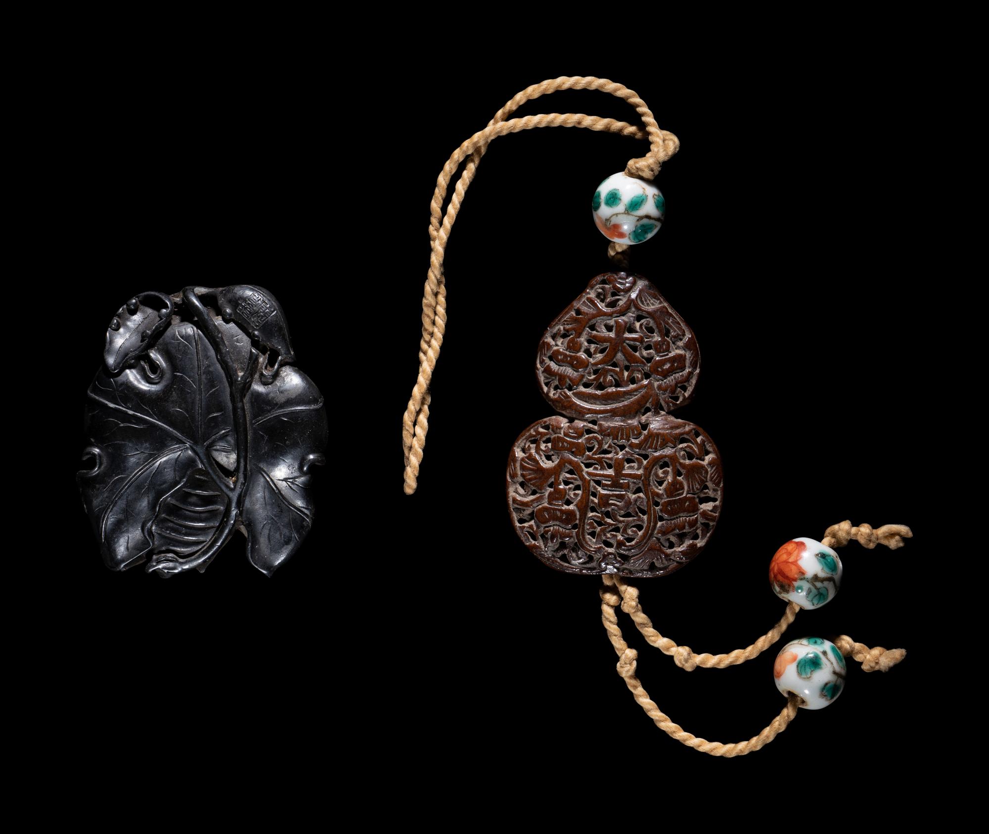 Two Chinese Carved Wood Pendants