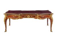 A Louis XV Style Gilt Bronze Mounted and Tooled Leather-Inset Tulipwood Bureau Plat