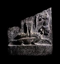 An Egyptian Black Steatite Cippus Fragment