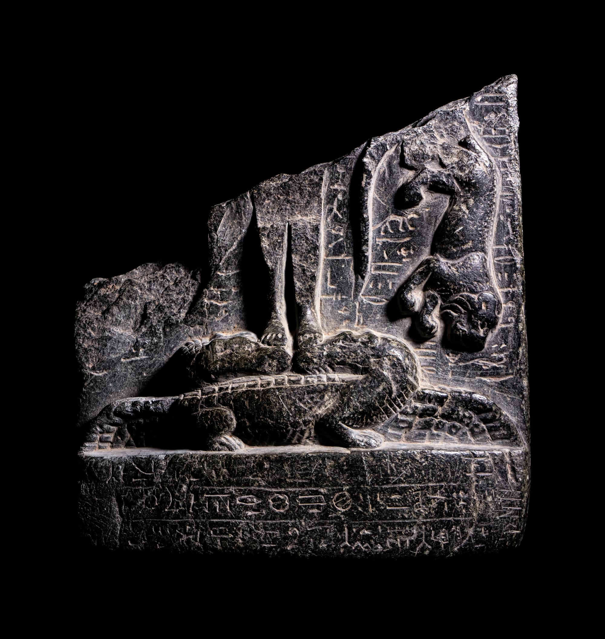 An Egyptian Black Steatite Cippus Fragment