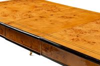 A Biedermeier Style Part-Ebonized Burlwood Dining Table