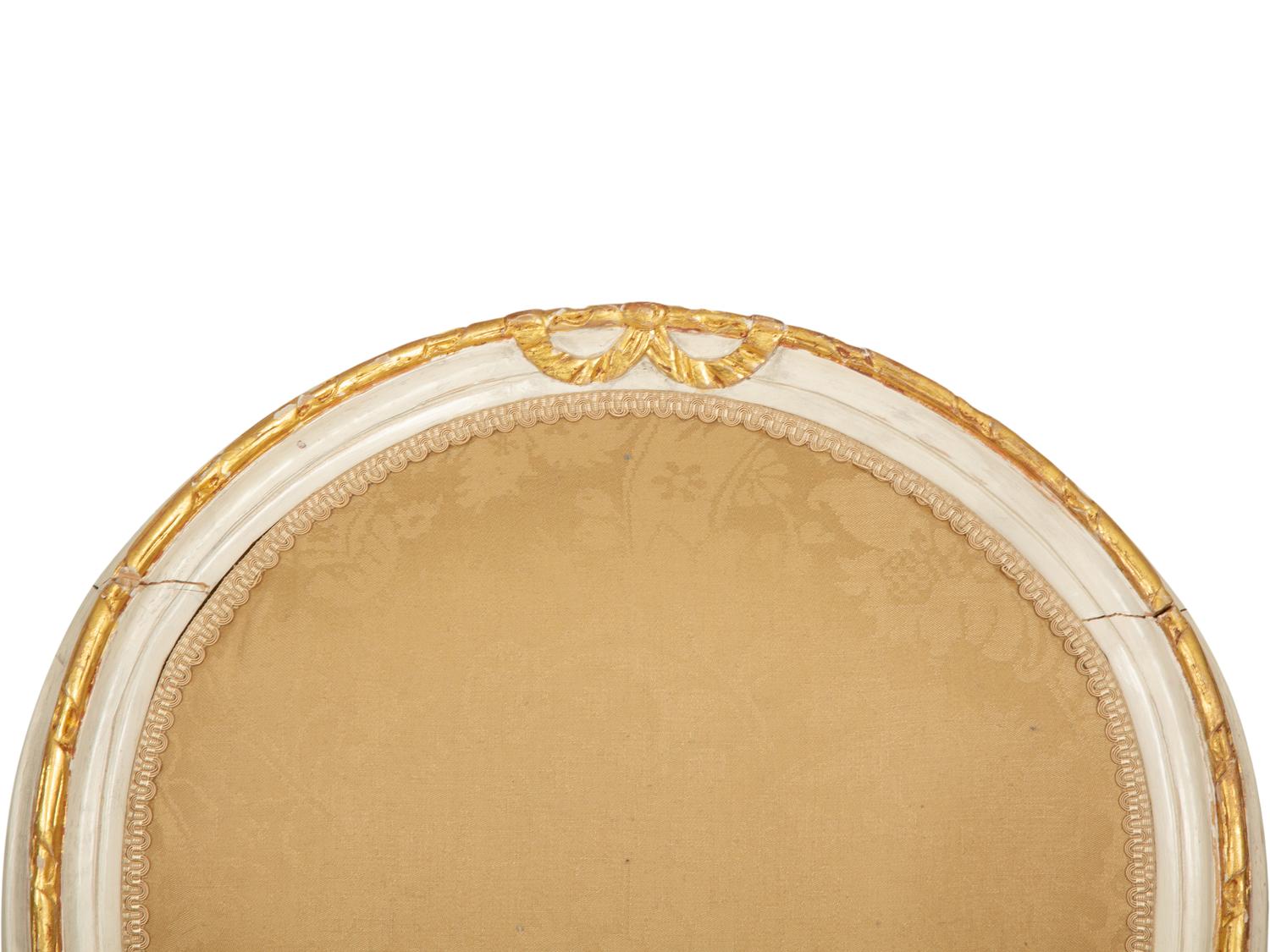 A Set of Eight Louis XVI Style Painted and Parcel Gilt Fauteuils