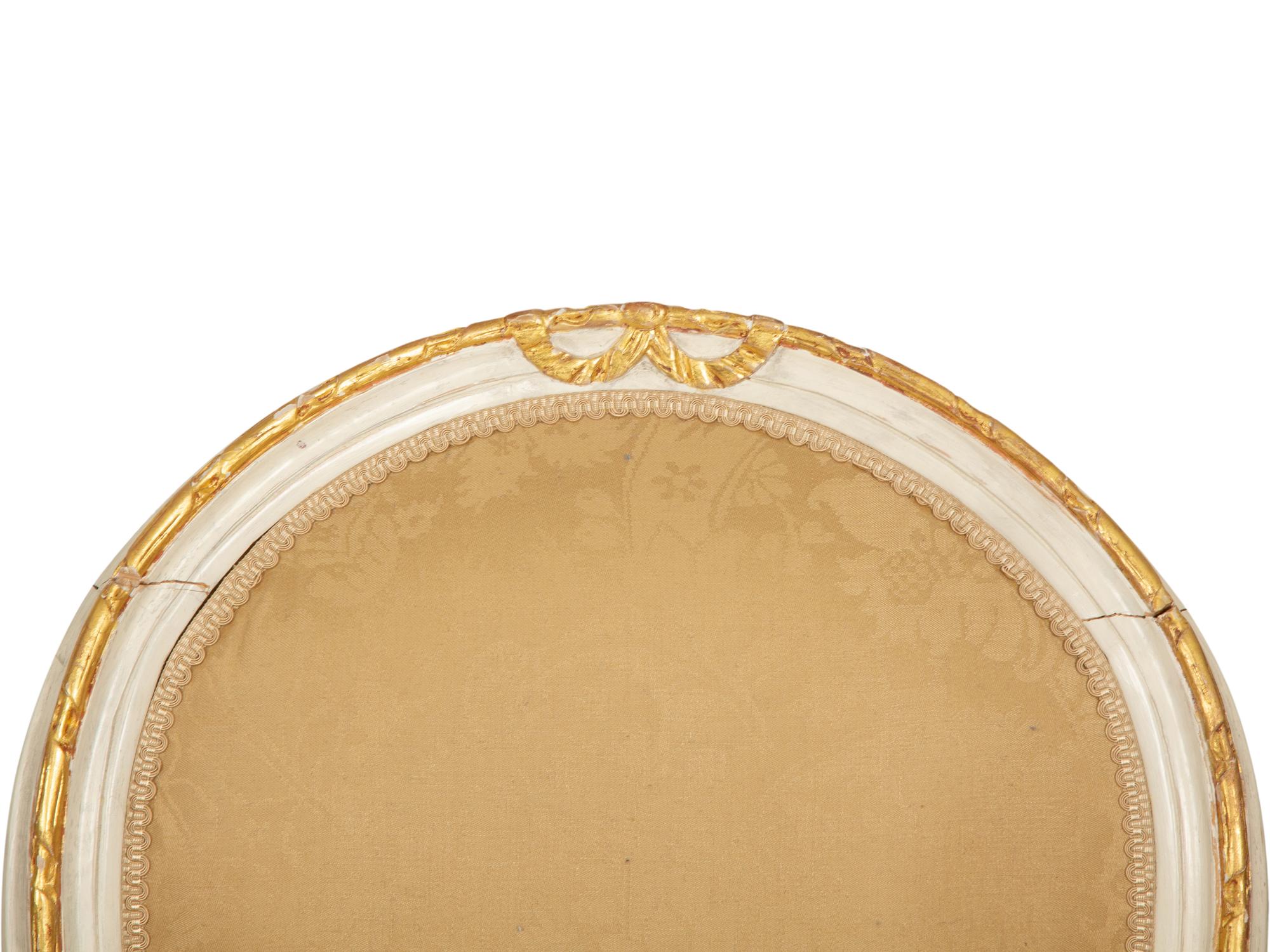 A Set of Eight Louis XVI Style Painted and Parcel Gilt Fauteuils