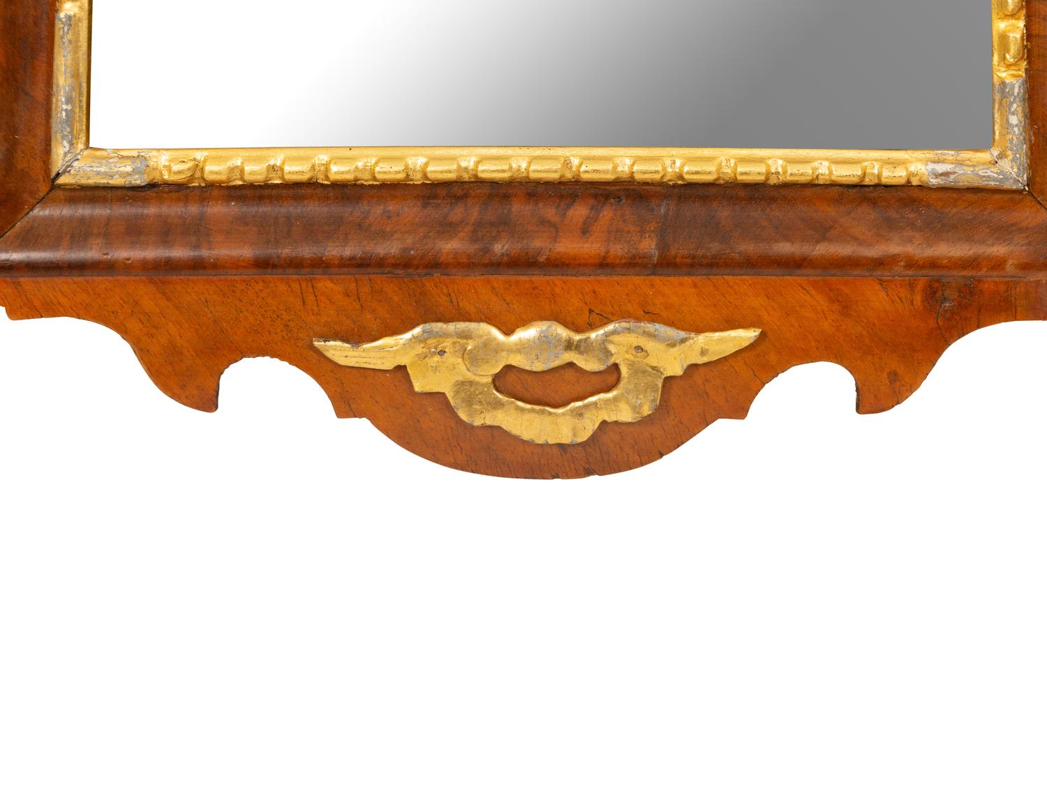 A George III Parcel Gilt Mahogany Mirror