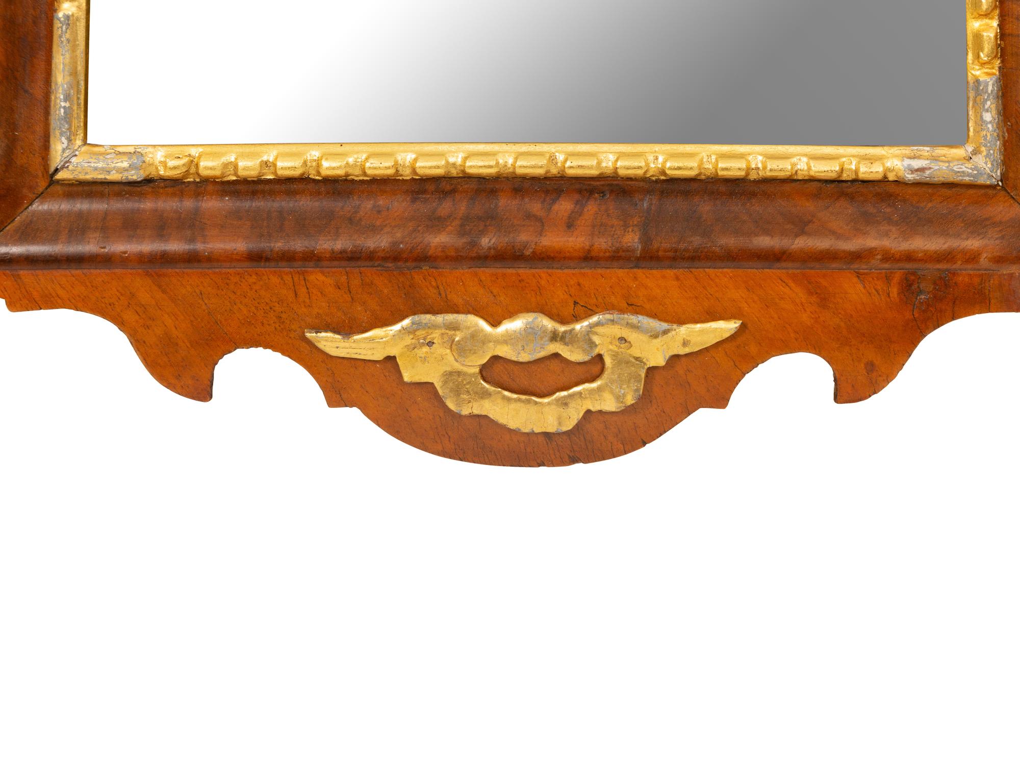 A George III Parcel Gilt Mahogany Mirror
