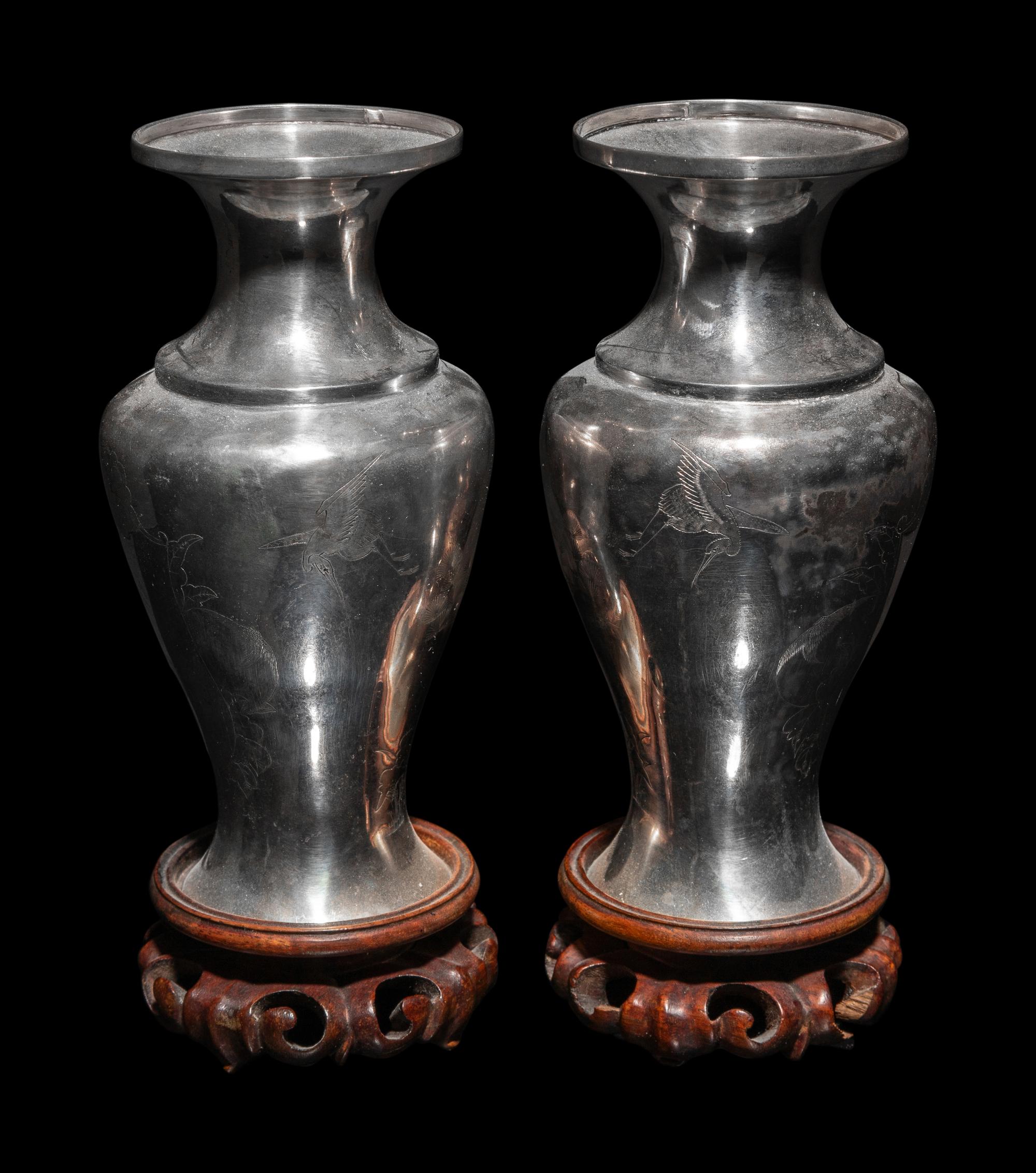 A Pair of Japanese Incised Silver Vases
