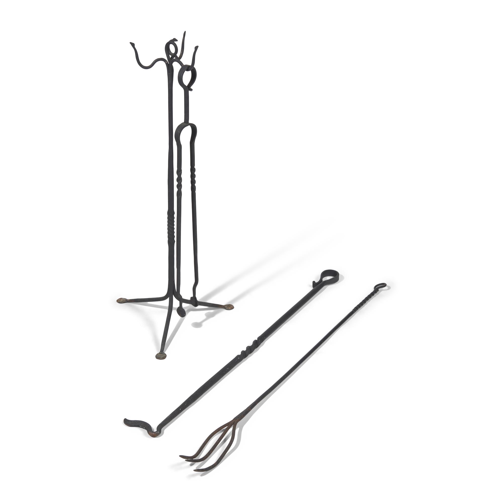 A Group of Four Arts and Crafts Wrought Iron Fireplace Tools