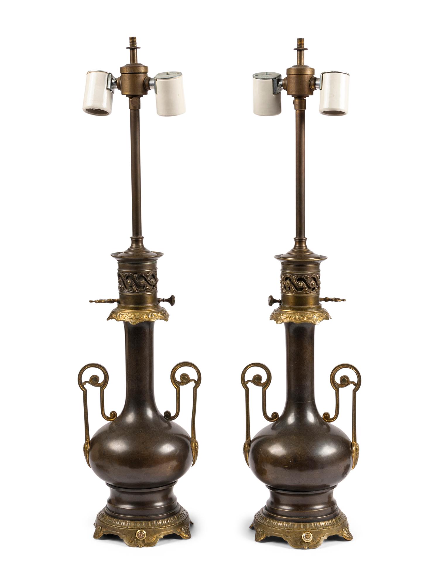 A Pair of French Gilt and Patinated Cast Metal Table Lamps