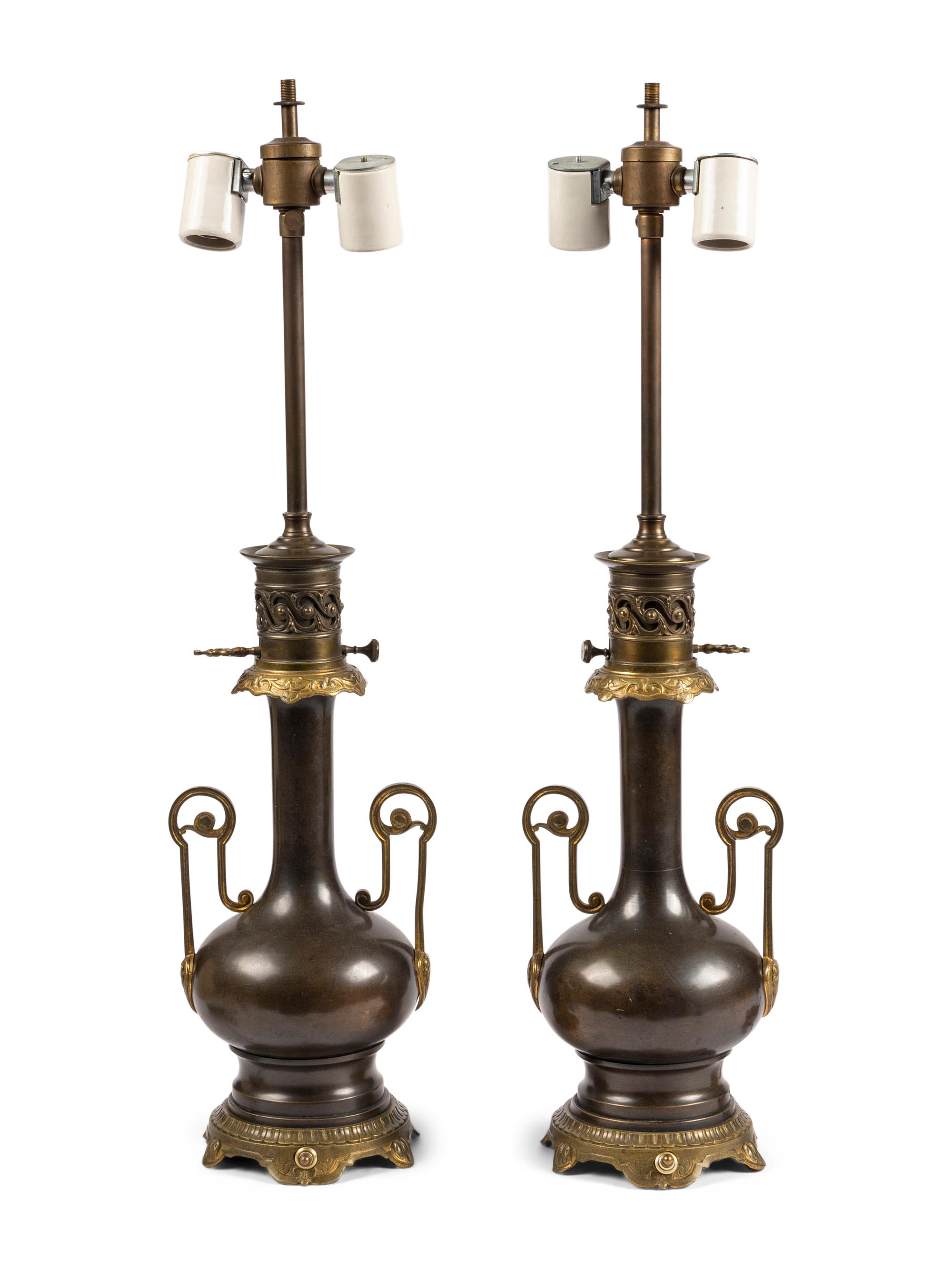 A Pair of French Gilt and Patinated Cast Metal Table Lamps
