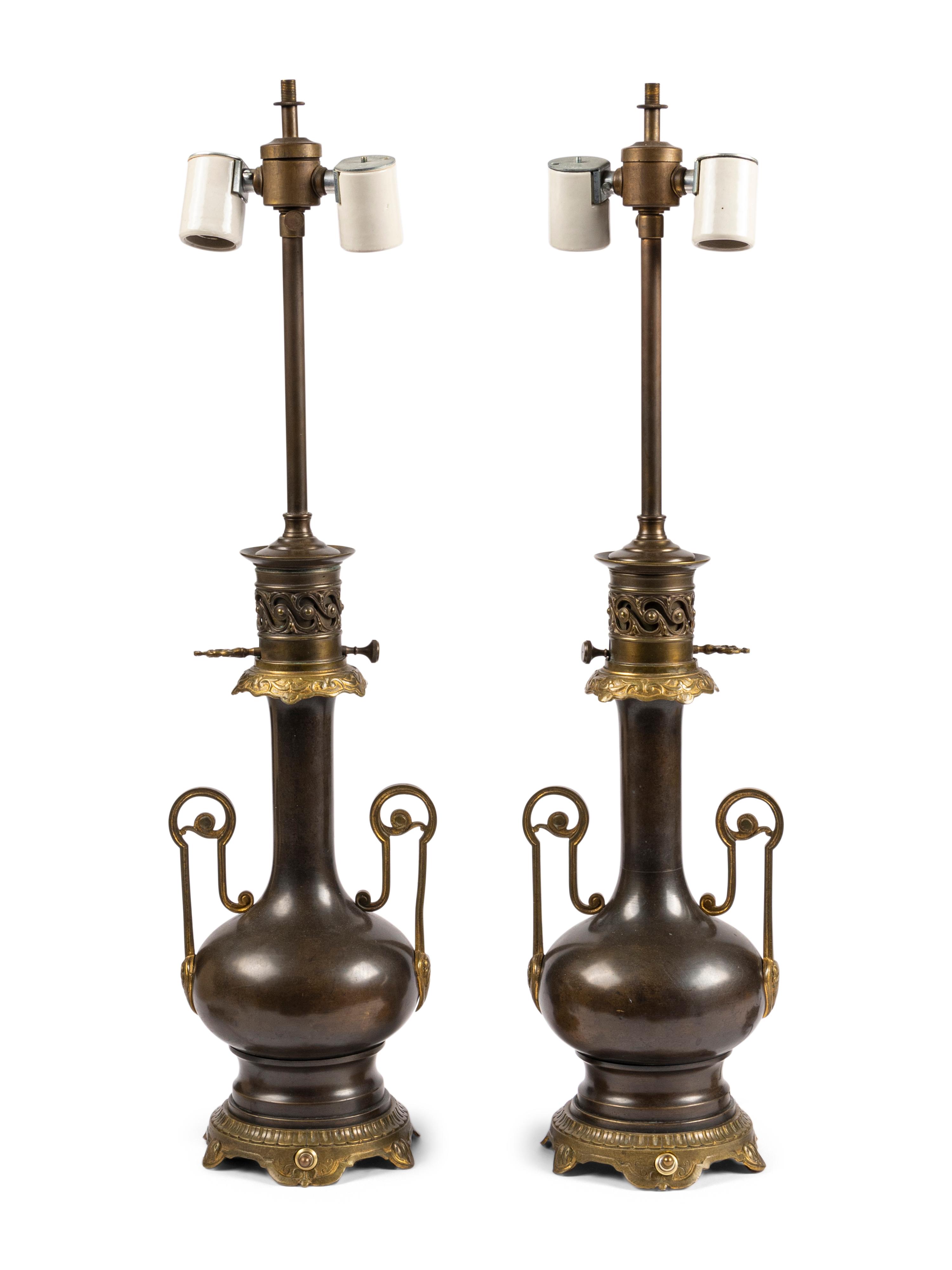 A Pair of French Gilt and Patinated Cast Metal Table Lamps