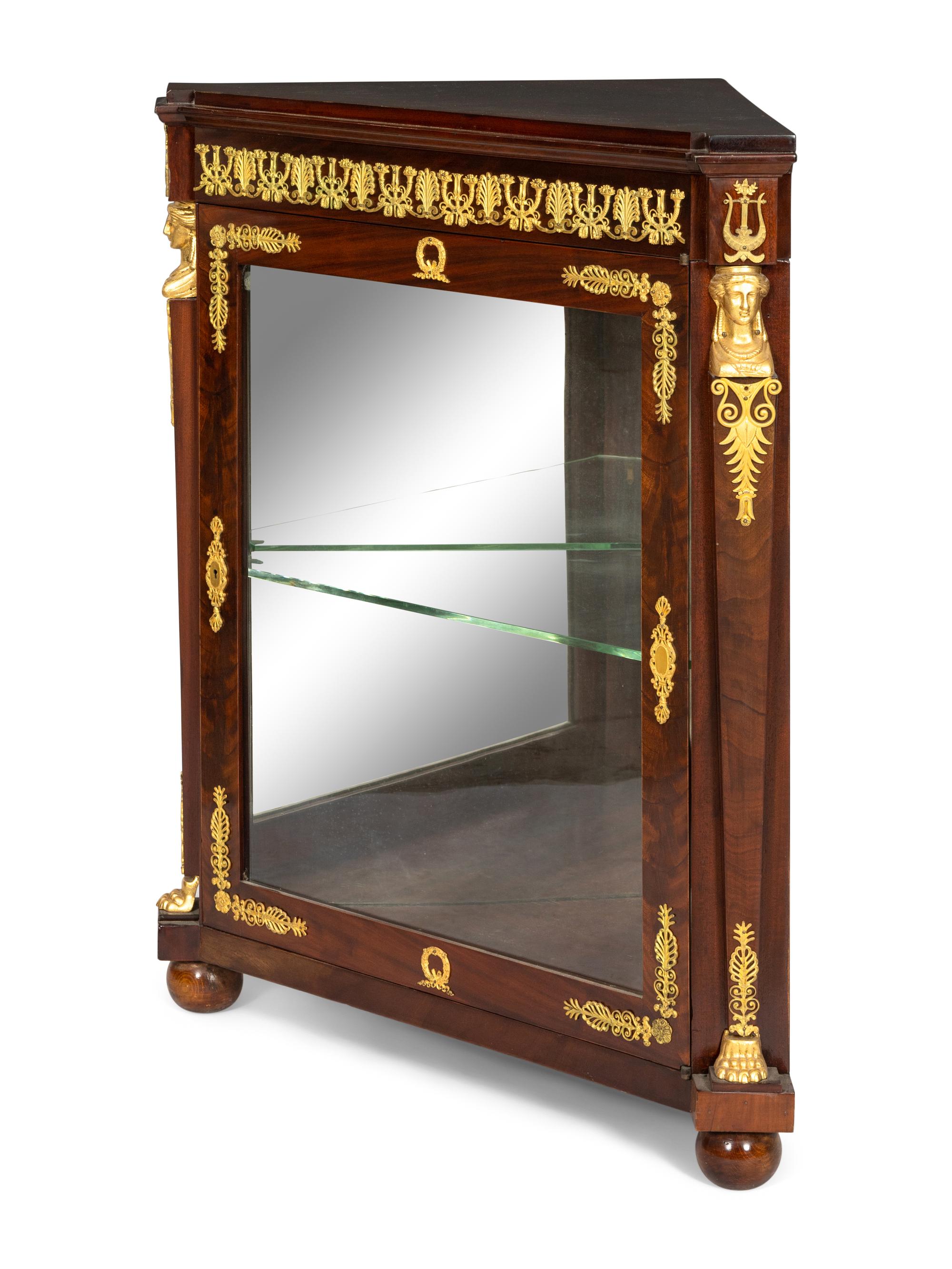An Empire Style Gilt Bronze Mounted Corner Cabinet