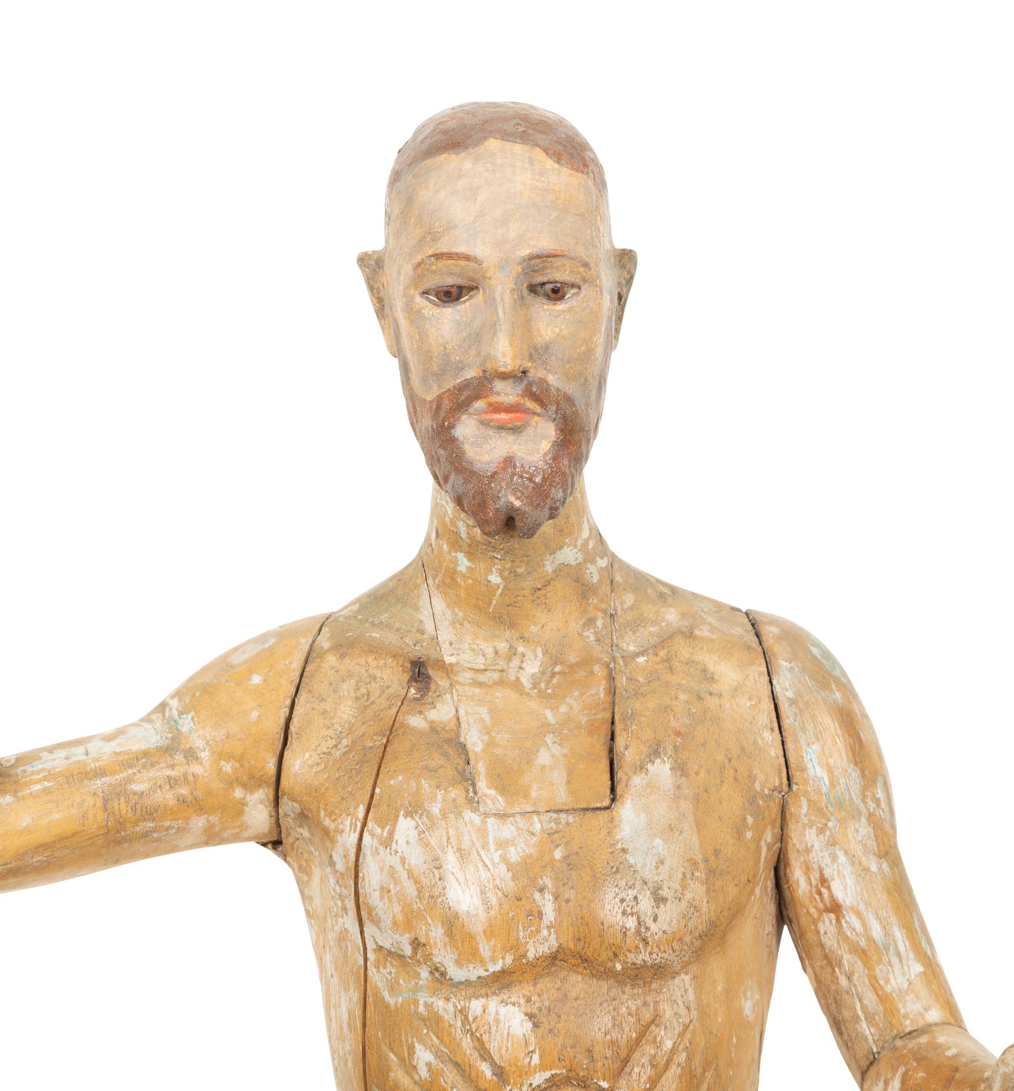 An Italian Carved and Polychromed Giltwood Santos Figure