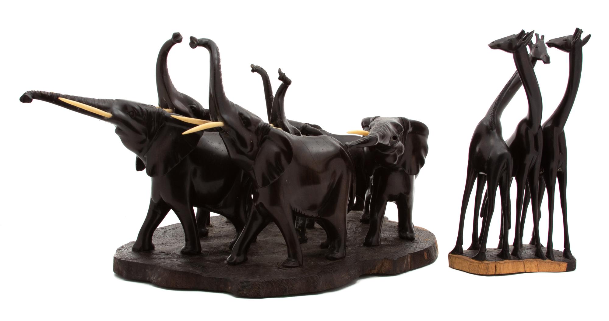 Two African Carved Wood Sculptures by John Musau Elephant Safari Sculpture Height of larger 11 inches. — 20TH CENTURY