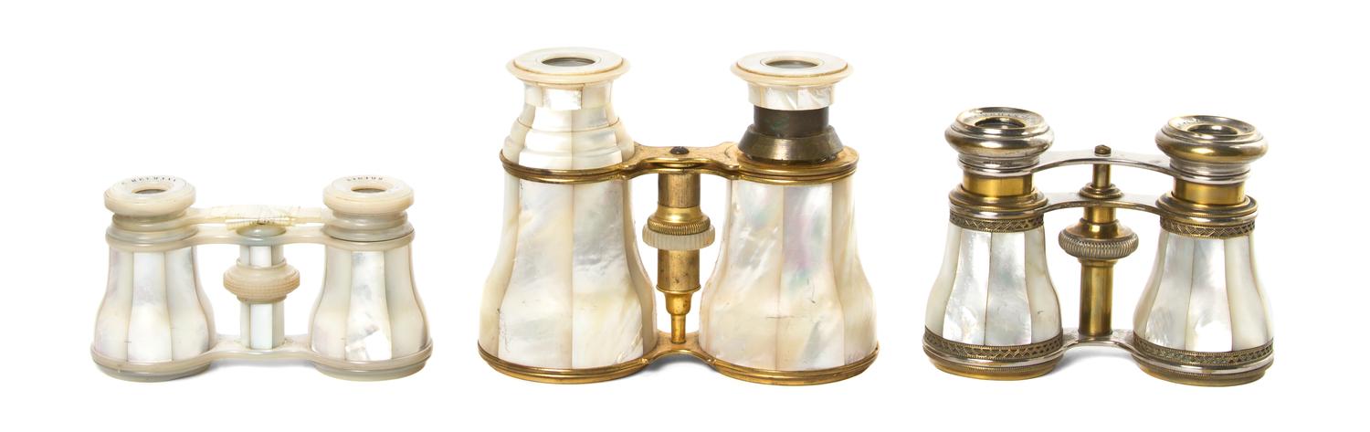 Three French Mother-of-Pearl Veneered Opera Glasses, Width of widest 4 3/4 inches.