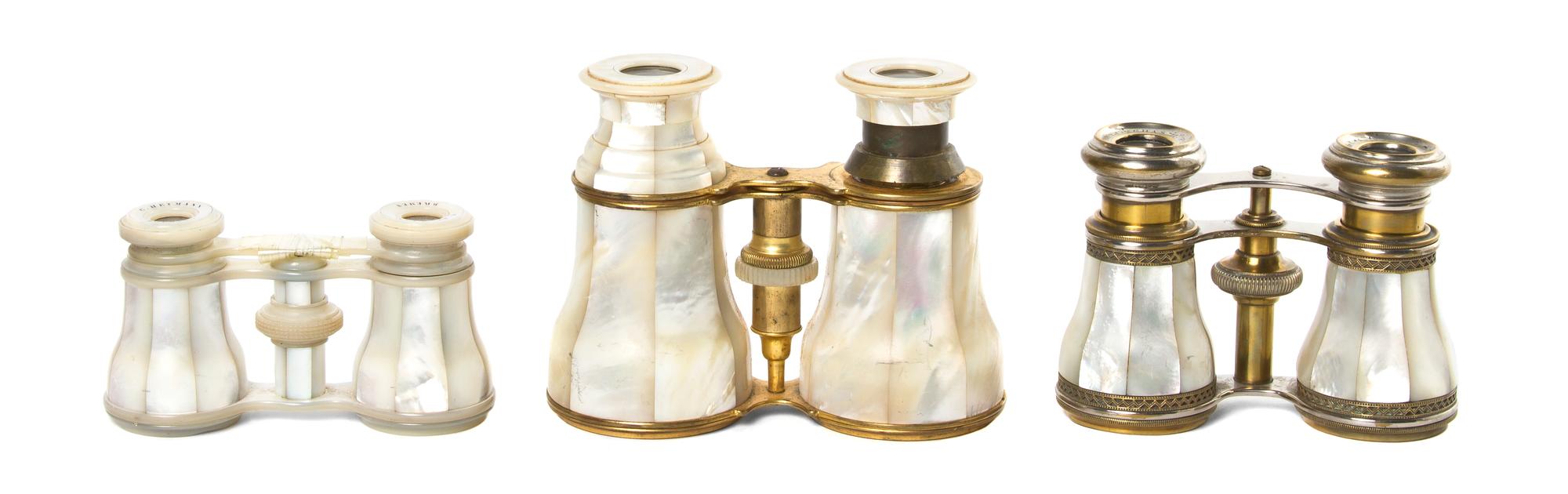 Three French Mother-of-Pearl Veneered Opera Glasses, Width of widest 4 3/4 inches.
