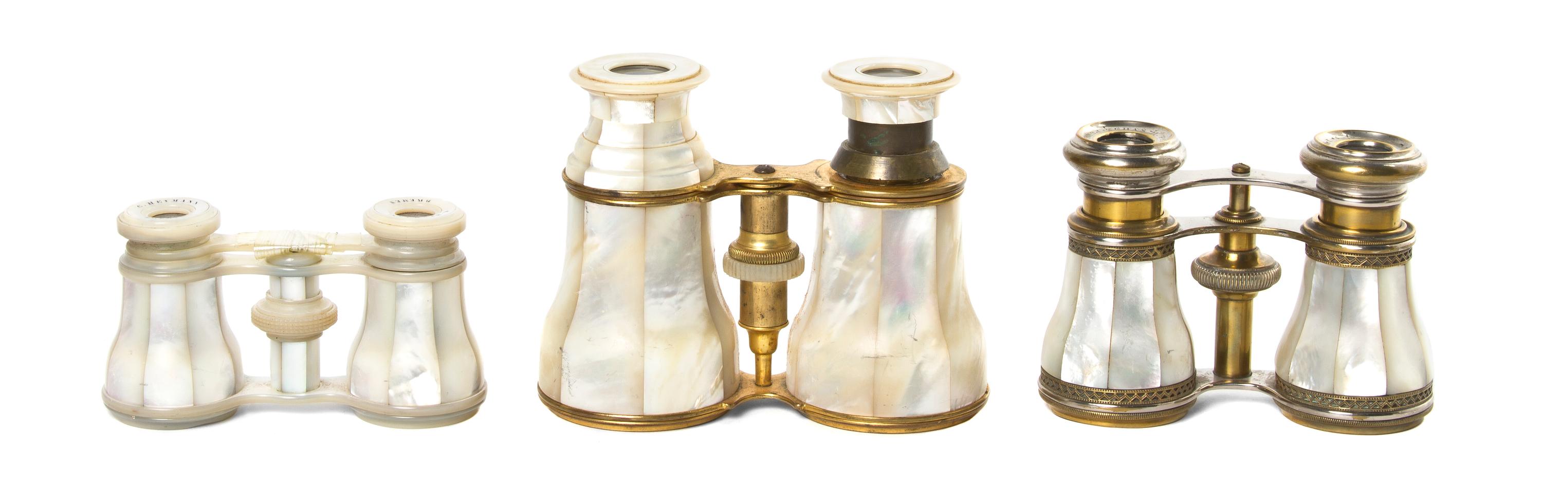 Three French Mother-of-Pearl Veneered Opera Glasses, Width of widest 4 3/4 inches.