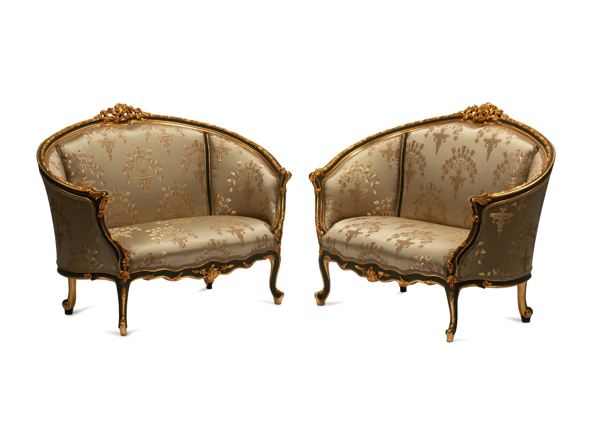 A Pair of Louis XV Style Painted and Parcel Gilt Settees