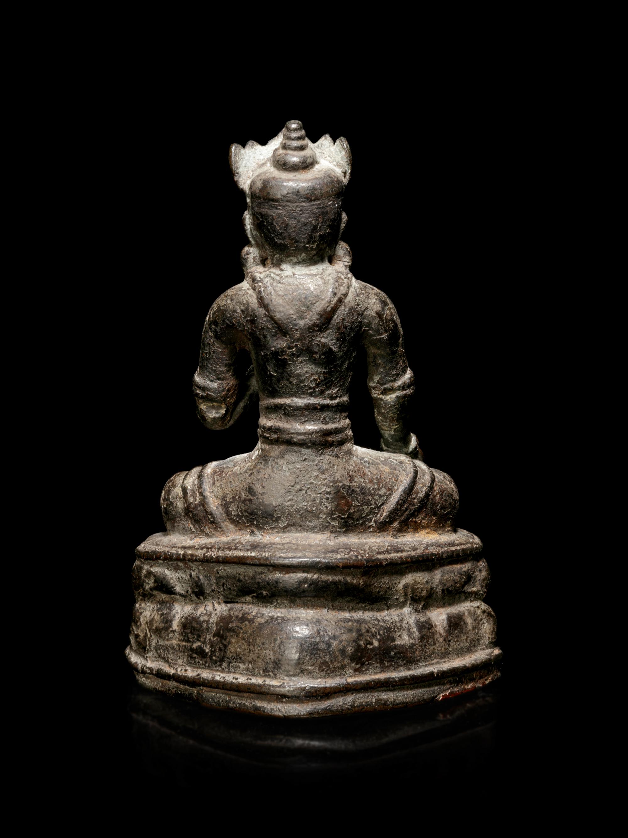 A Sino-Tibetan Bronze Figure of a Seated Crowned Buddha
