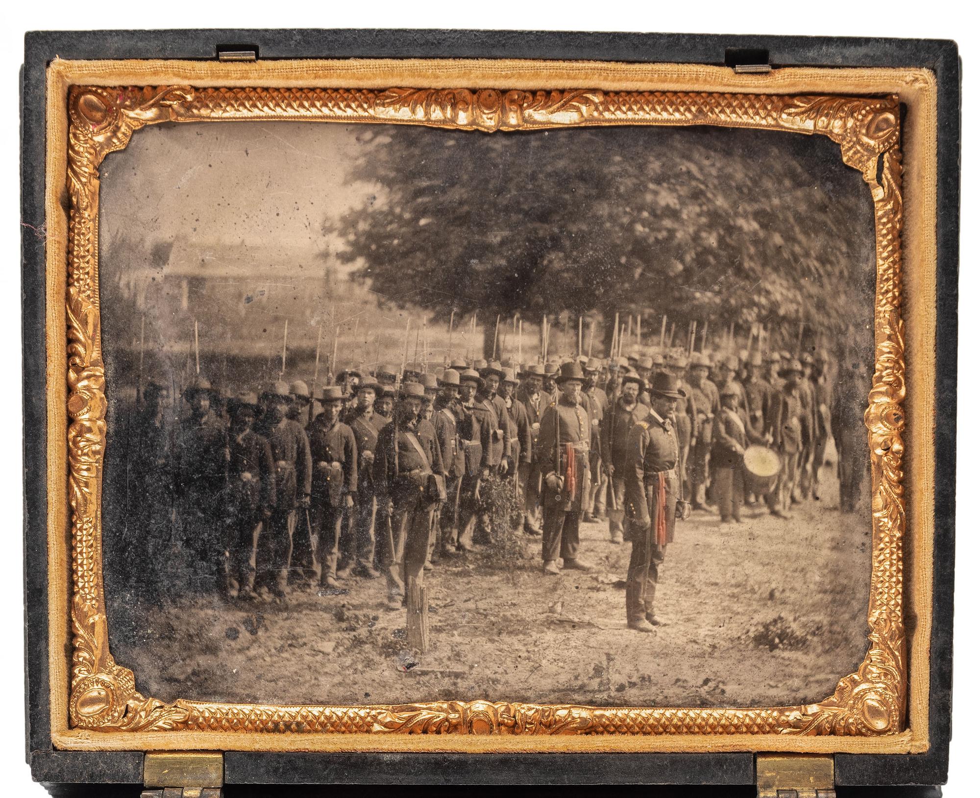 [CIVIL WAR]. Quarter plate tintype of Union officers leading western Infantry company. N.p.: N.p., [1861-1865].