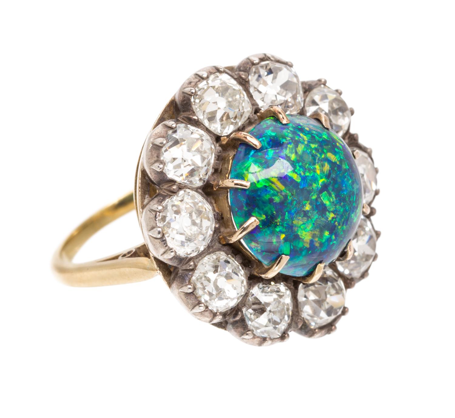 A Victorian Silver Topped Gold, Black Opal and Diamond Ring, 4.60 dwts.