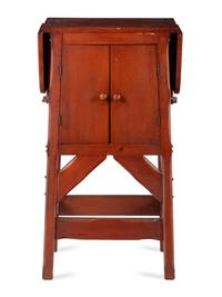 A Red Stained Drop-Leaf Cabinet