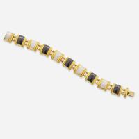 An 18K Yellow Gold, Onyx, and Diamond Bracelet