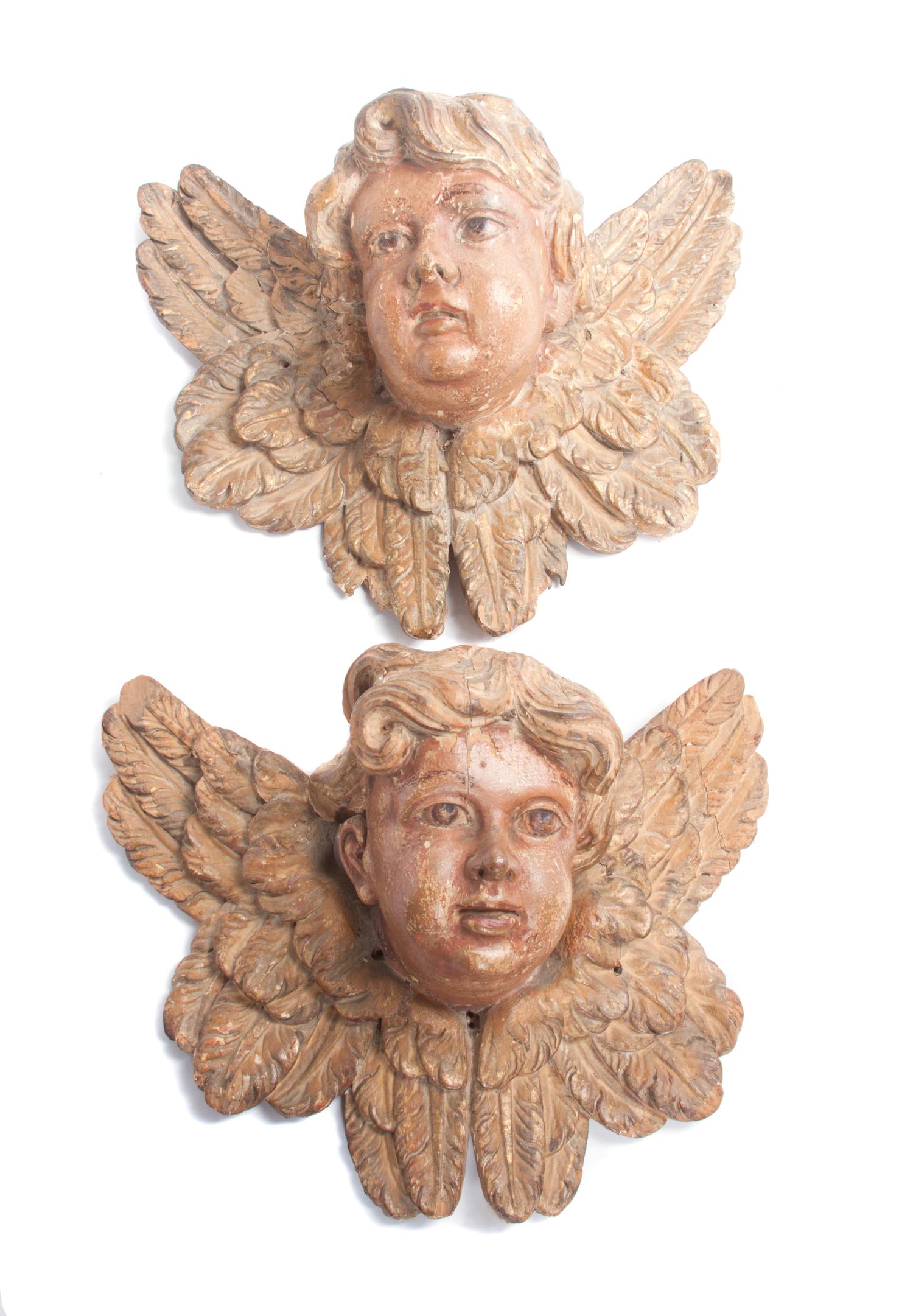 A Pair of Painted Wooden Masks Width 13 inches.