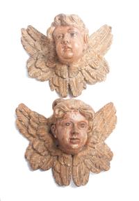 A Pair of Painted Wooden Masks Width 13 inches.