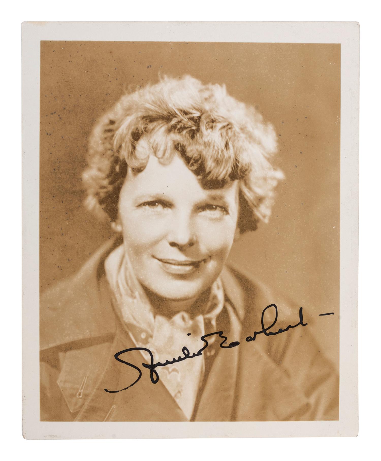 EARHART, Amelia (1897-1937). Photograph signed. [With:] Last Flight . 1937.