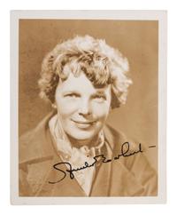 EARHART, Amelia (1897-1937). Photograph signed. [With:] Last Flight . 1937.
