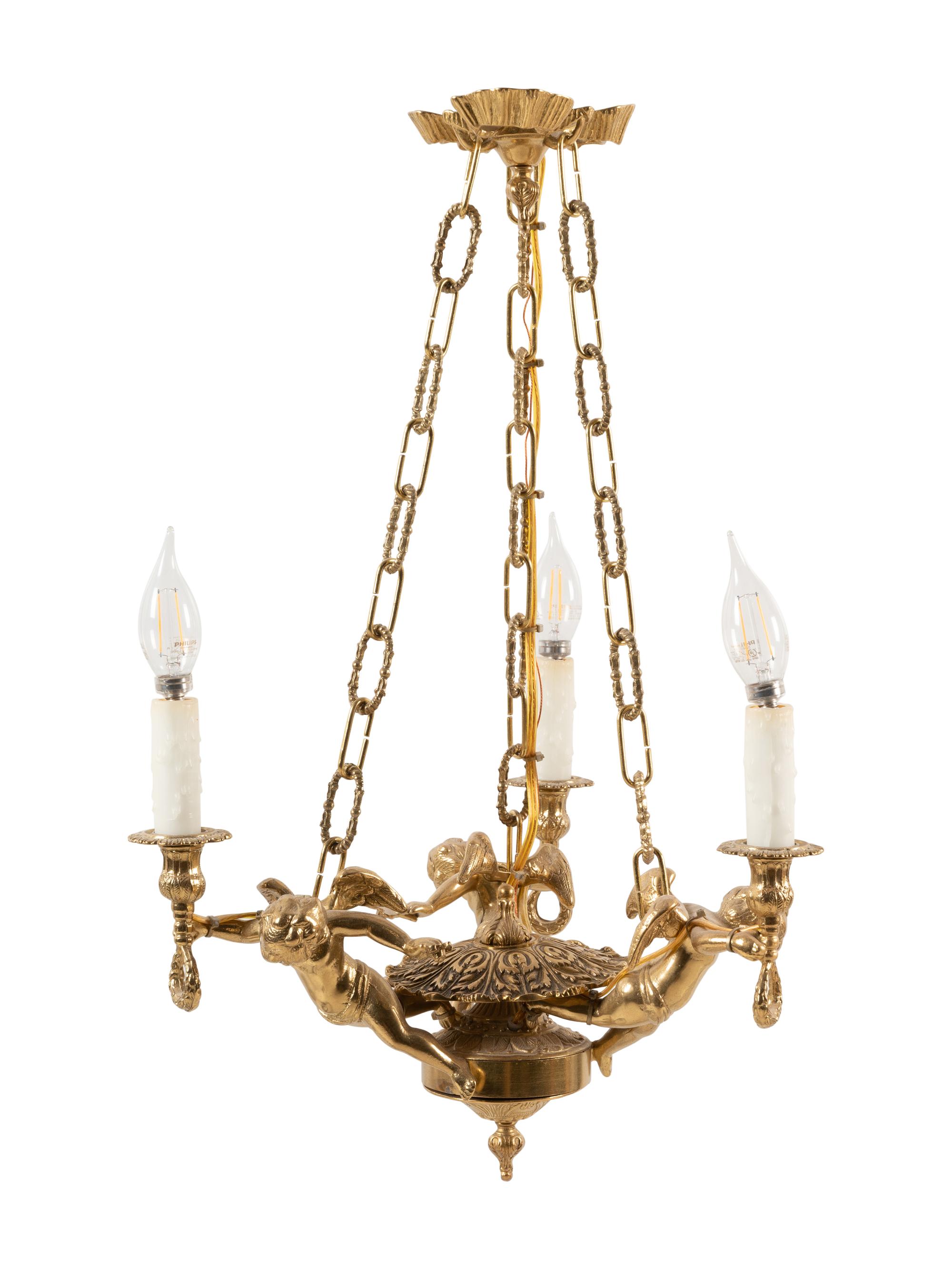 A Continental Gilt Metal Figural Three-Light Chandelier