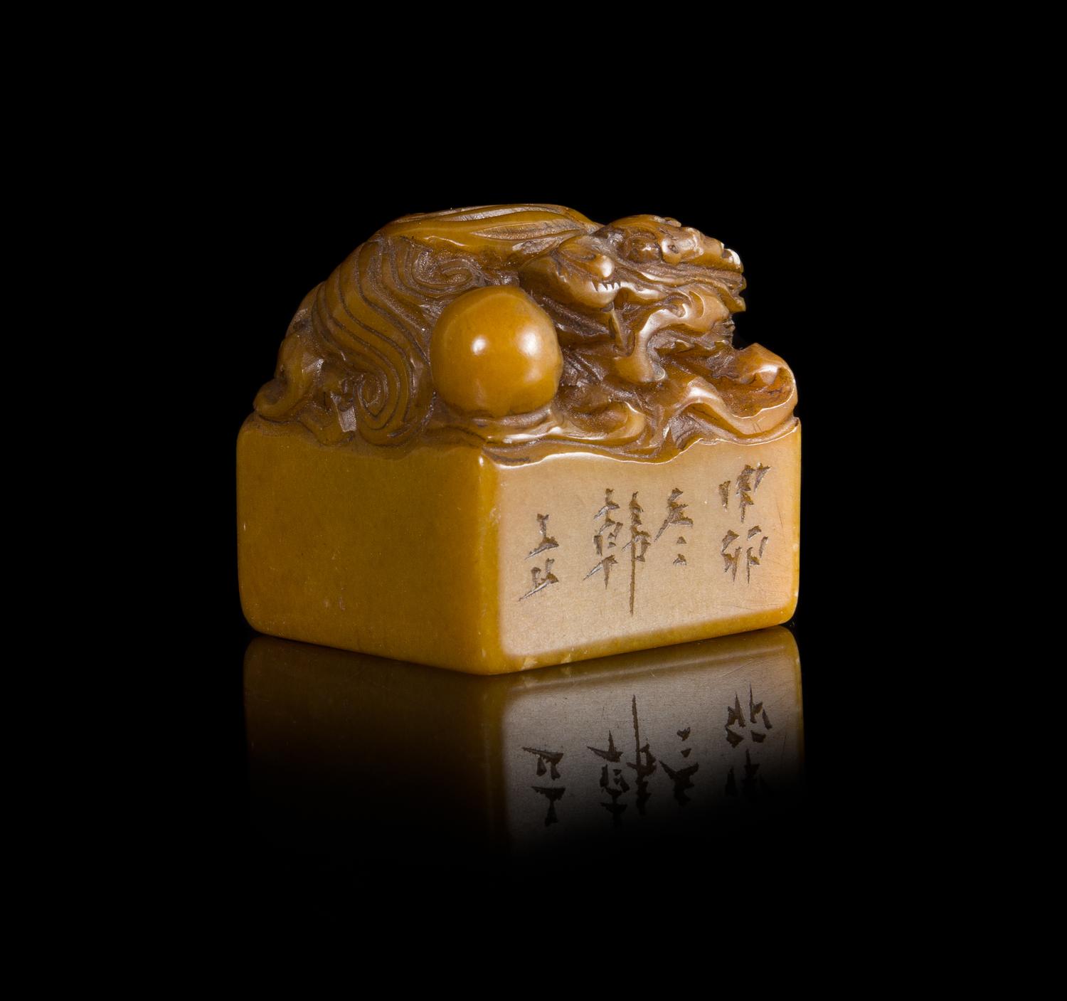 A Carved Yellow Soapstone Seal Height 1 3/4 inches.