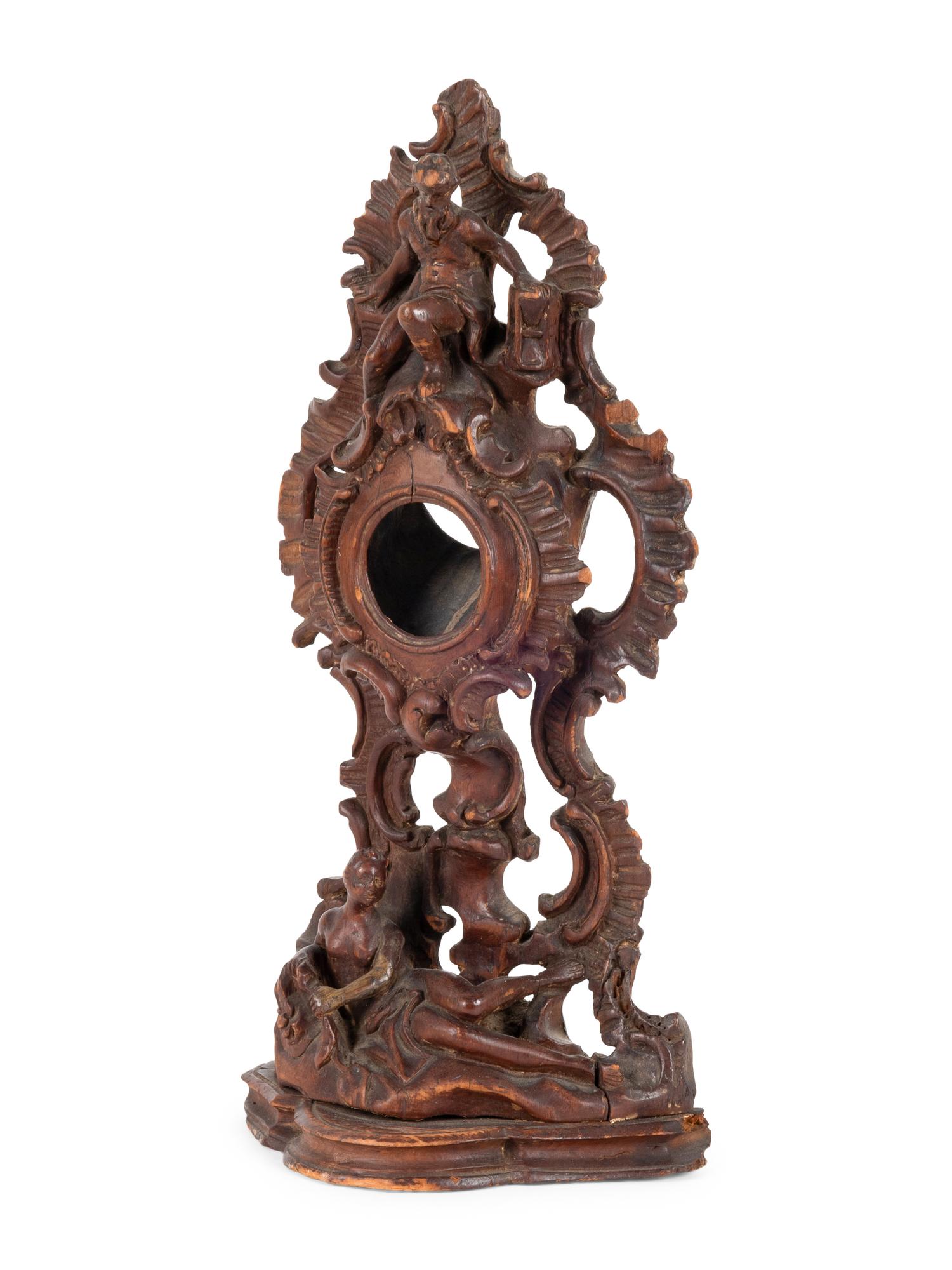 A Continental Rococo Style Carved Fruitwood Watch Stand