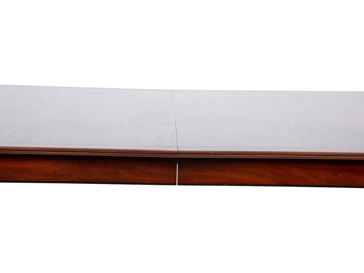 A Regency Style Inlaid Mahogany Dining Table — 20TH CENTURY