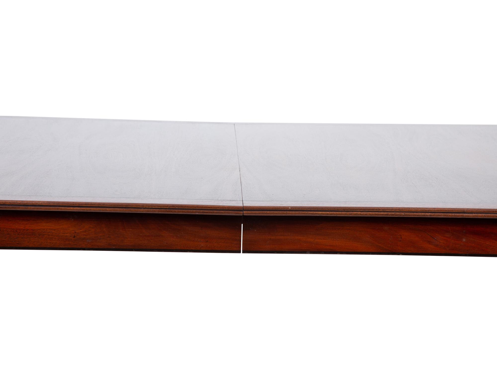 A Regency Style Inlaid Mahogany Dining Table — 20TH CENTURY