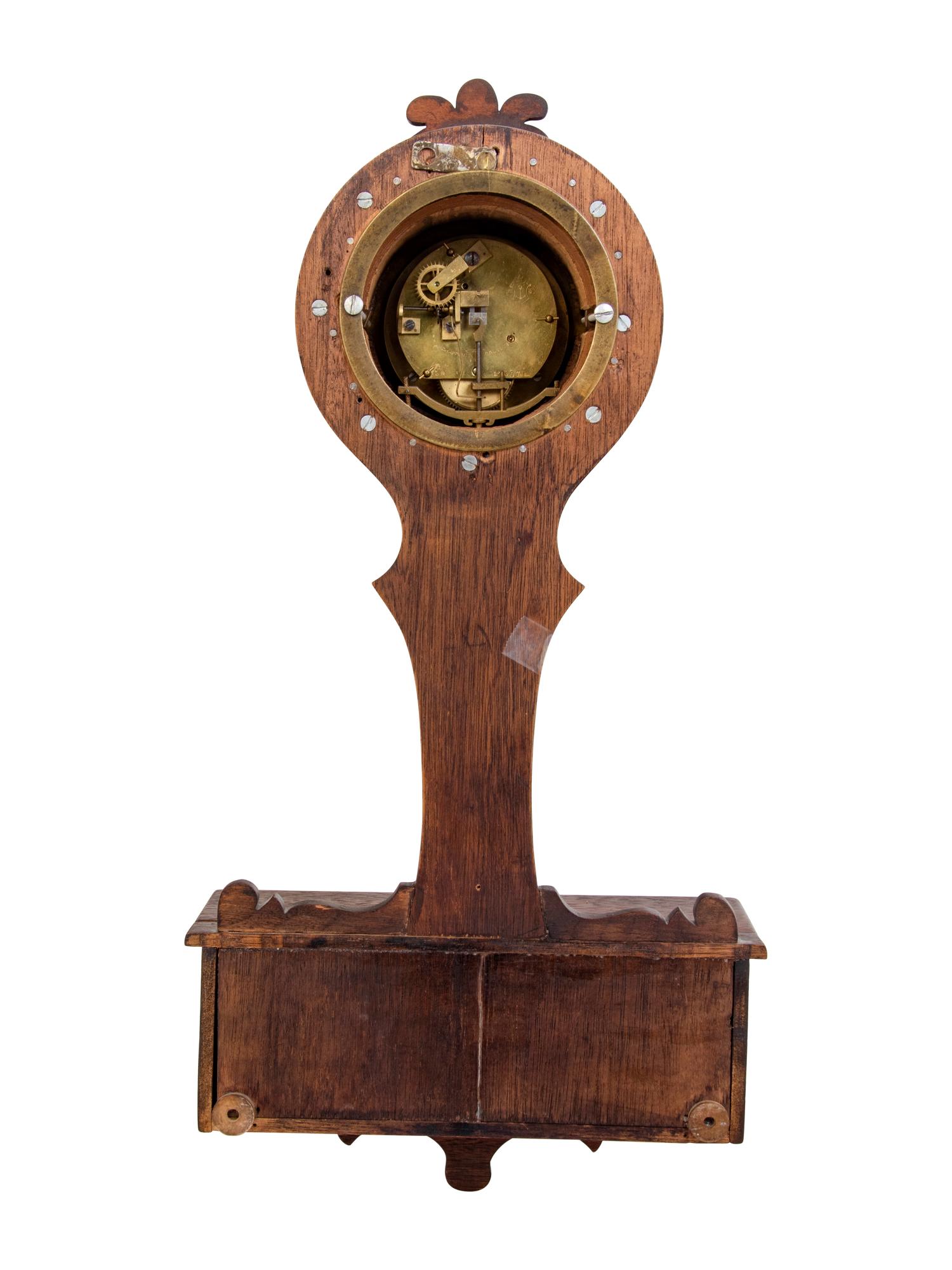 A Continental Oak Cased Wall Clock