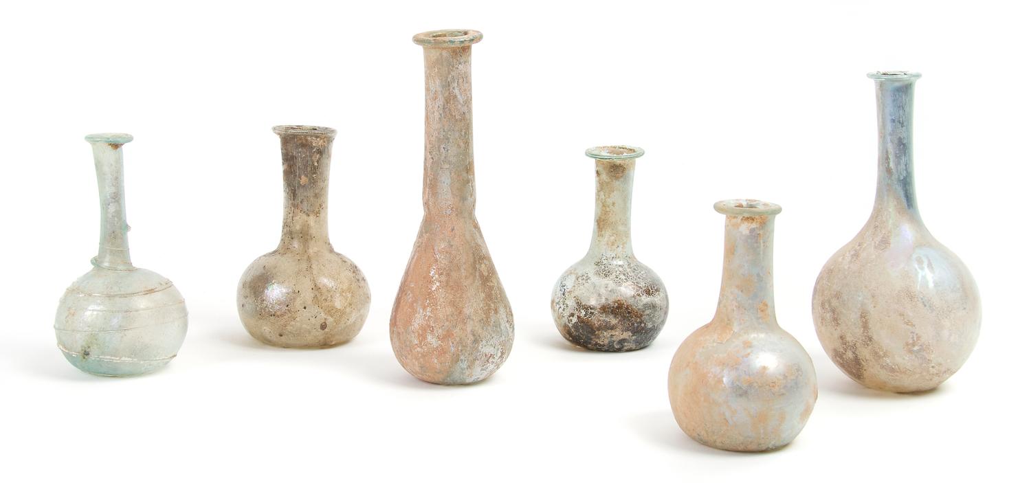A Collection of Six Roman Glass Flasks, Height 5 1/4 inches.