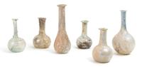 A Collection of Six Roman Glass Flasks, Height 5 1/4 inches.