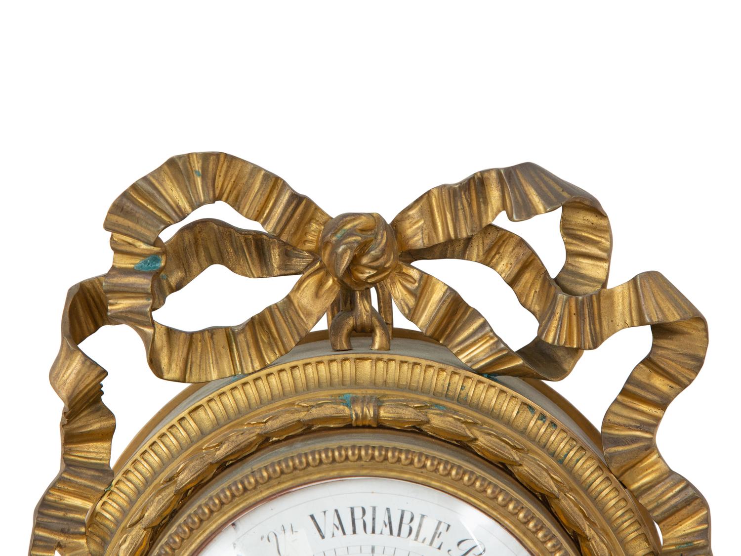 A Louis XVI Style Gilt Bronze Cartel Clock and Matching Barometer